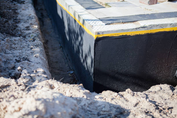 Professional Basement Waterproofing technician working in Camden, TN